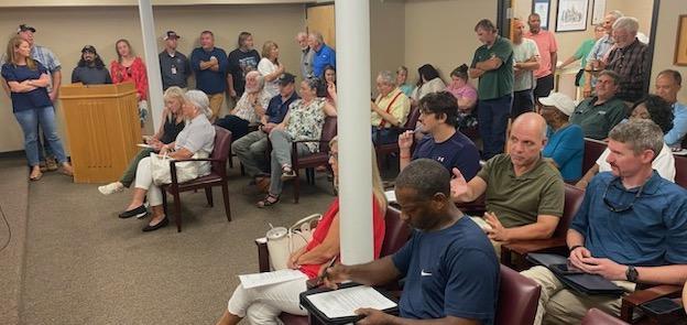 About 60 people packed the Board of Commissioners’ meeting room on Monday night. The BOC unanimously voted to reject the rezone for a dimension stone quarry on Lexington-Carlton Road after the vote was tabled in the May and June meetings. (Dink Nesmith/The Oglethorpe Echo)