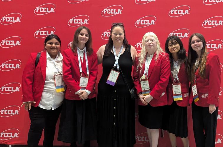 Emily Williams (middle) advised students Marlene Bahena (from left), Grace Foland, Johanna Castellanos, Ellen Hgay and Miley Christian, who competed at the FCCLA Nationals in Seattle this summer. (Sarah Coyne/The Oglethorpe Echo)