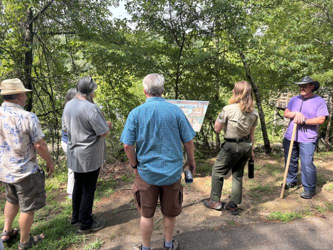 Naturalist Sarah Ratcliffe explains the origins of Watson Mill Bridge while conducting a history hike through the park. The bridge was constructed by acclaimed bridge builder Washington W. King and completed in 1885. (Jack Keys/The Oglethorpe Echo)