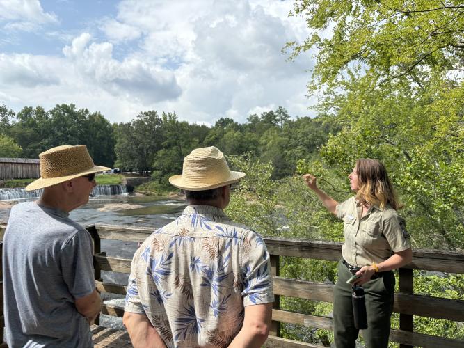Naturalist Sarah Ratcliffe explains the history of Watson Mill Bridge while conducting a history hike through the park. The bridge, standing at a length of 229 feet, is the longest surviving covered bridge in Georgia. (Jack Keys/The Oglethorpe Echo)