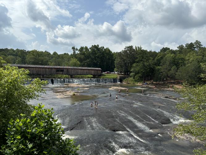 Swimming and sliding downs rocks in the South Fork Broad River are popular among youth at Watson Mill Bridge State Park. (Jack Keys/The Oglethorpe Echo)