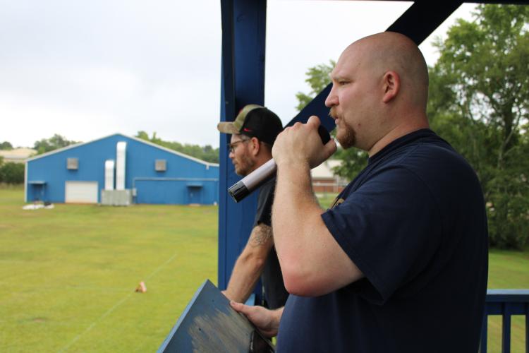 Director, Lee Jones directs the band through the first part of their show. (Sarah Coyne/The Oglethorpe Echo)