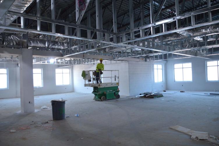 A construction worker stands in what will become the media center for the new Oglethorpe County Elementary School. Construction is scheduled to finish on December 4. (McCain Bracewell/The Oglethorpe Echo)