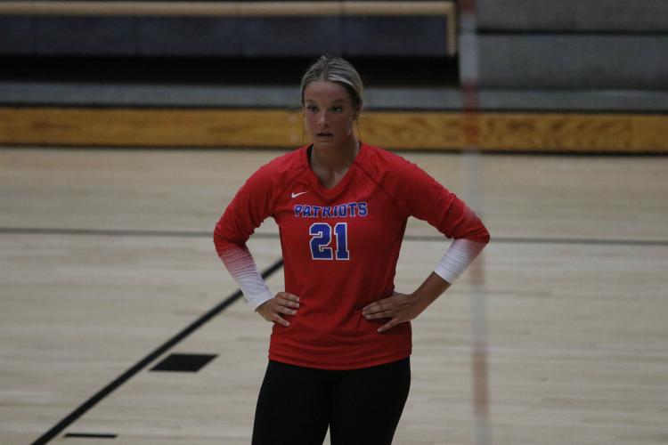 Junior Elizabeth Cook catches her breath between rallies in a scrimmage against Rabun County Tuesday. The Patriots debuted new red uniforms in the scrimmage. (Torin Smith/The Oglethorpe Echo)