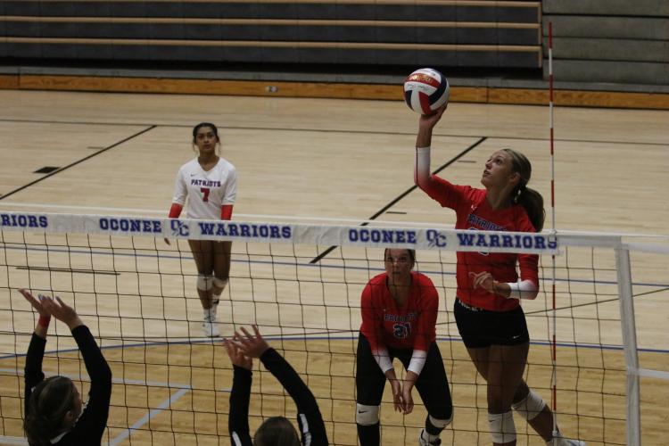 Freshman Leanna Newton tips a pass over the net to score a point in a scrimmage against Rabun County Tuesday. (Torin Smith/The Oglethorpe Echo)