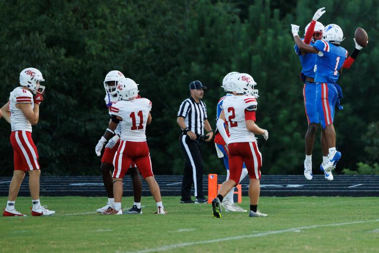 Oglethorpe County’s Justin Jackson and Jordan Johnson (1) celebrate a long reception by Jackson in the Patriots’ 48-41 season-opening loss to Social Circle on Aug. 16. Jackson finished with two catches for 51 yards. (Mark Johnson/The Oglethorpe Echo)