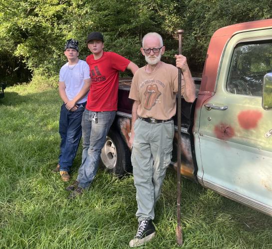 Left: Lucas Stephens, Caden Berggren and James Bennett pose in front of Bennett's truck. (MCCAIN BRACEWELL/THE OGLETHORPE ECHO)