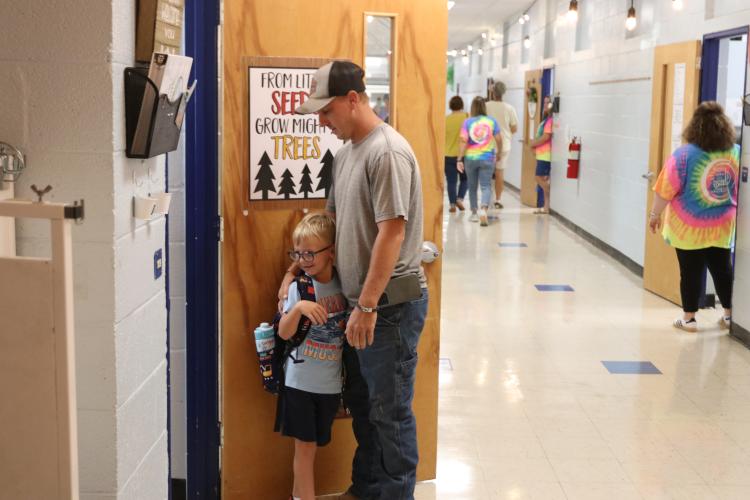 Brandon Smith drops off his son Leeland Smith at his kindergarten class at Oglethorpe County Primary School on Aug. 8. This is the final year for OCPS, which will close when the new elementary school opens in January. (Torin Smith/The Oglethorpe Echo)