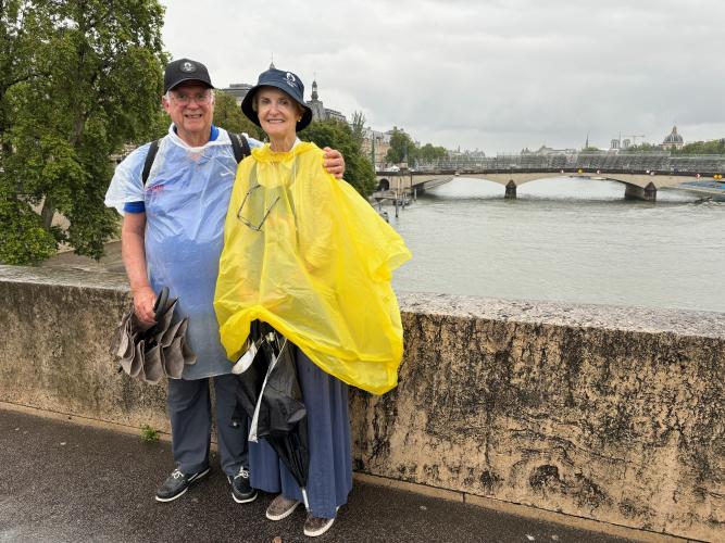 Smithonia’s John and Jane Robertson stand on a bridge in Paris on July 27. They traveled to Paris to attend several events, including basketball, track and field, synchronized diving, gymnastics, swimming and beach volleyball. (Submitted Photo)