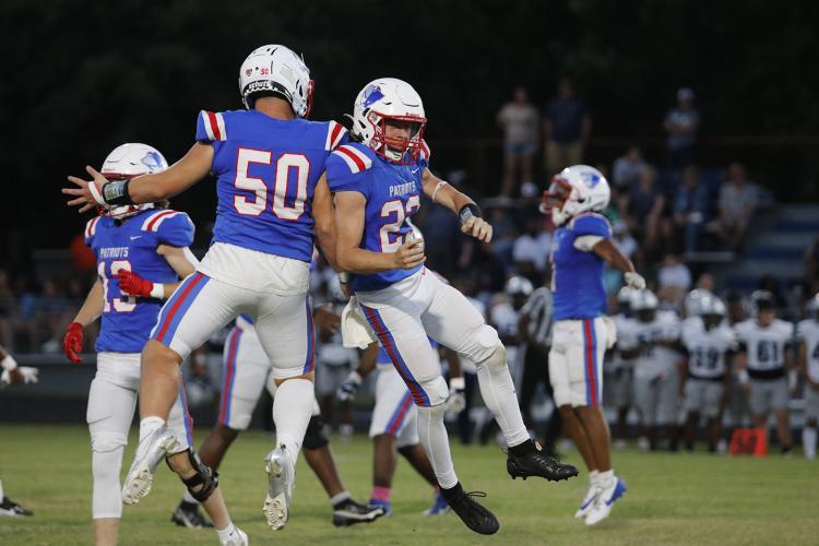 Tanner Mckie (50) and Matthew Martin (23) celebrate after recovering a fumble during Oglethorpe County’s homecoming game against Elbert County on Sept. 20, 2024. Martin also had four tackles and forced the fumble. (Photo/ McCain Bracewell)