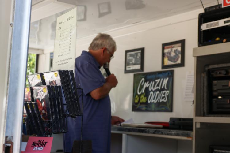 Tommy Landrum emcees the Firefly Cruise-In at the Oglethorpe County Courthouse, Sept. 22, 2024. Landrum’s DJ business, Cruizin’ to the Oldies, specializes in music from the '60s and '70s to play at various car shows throughout the Southeast. (Kendall Kelly/Oglethorpe Echo)
