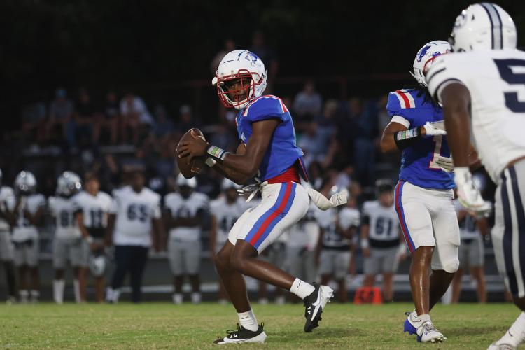 Oglethorpe County’s Darius Heard looks for a receiver during the Patriots’ game against  Elbert County on Sept. 20, 2024. The Blue Devils defeated OCHS 46-13 to drop the Patriots to  0-5 and 0-1 in Region 8-A Division I. (Photo/Avni Trivedi)