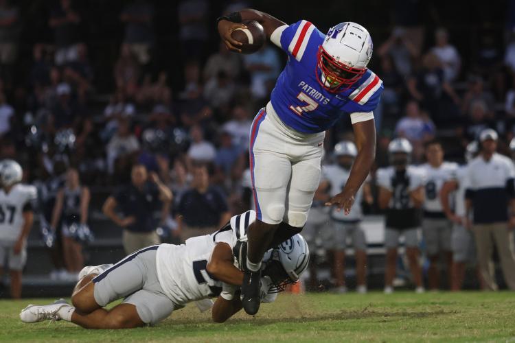 Oglethorpe County running back Payton Prince tries to escape the grasp of Elbert County defensive back Jose Rodriquez during the Blue Devils’ 46-13 victory over the Patriots on Sept. 20, 2024. Prince returned to the lineup after missing time with an injury. (Photo/Avni Trivedi)