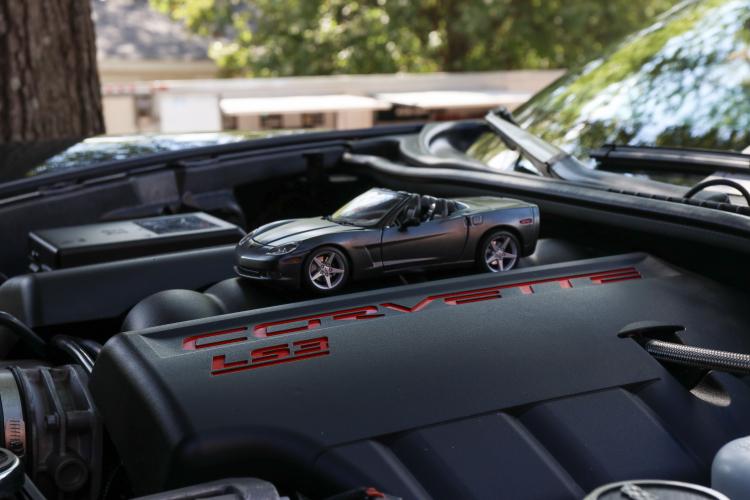 A toy replica sits on the engine of a 2010 Corvette GS Convertible. Fred O’Neill purchased the car off of eBay to match his Corvette Convertible. (Kendall Kelly/Oglethorpe Echo)