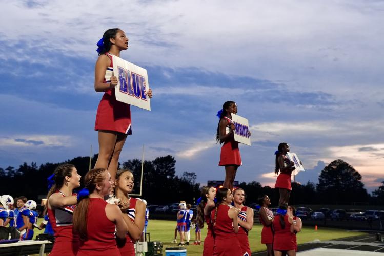 The Oglethorpe County cheerleading team fires up the crowd during the Patriots’ 20-17 loss to Washington-Wilkes on Aug. 30. The home stands were filled with fans and parents of rec department football players and cheerleaders on Rec Night. (Saylor Williams/The Oglethorpe Echo)