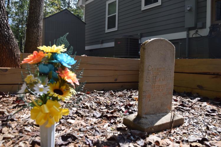 The headstone of Claudie A. Hunter marks the family gravesite on Don Davis’ property on Buddy Faust Road. Details of Hunter’s life are unknown, other than the information on the tombstone. (MARY CATHERINE DODYS/THE OGLETHORPE ECHO)