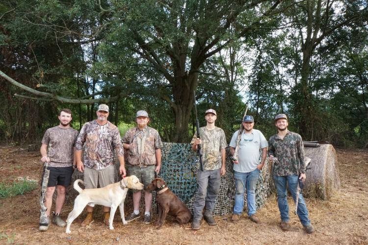 Tanner Nation (from left), Adam Nation, Tristan Nimmons, Nick Drake, Zach Erwin and Landon Faust take a break from hunting on the first day of dove season at the Nation family farm. The Nations have hosted folks at their farm for decades. (ALEX PERRI/THE OGLETHORPE ECHO)