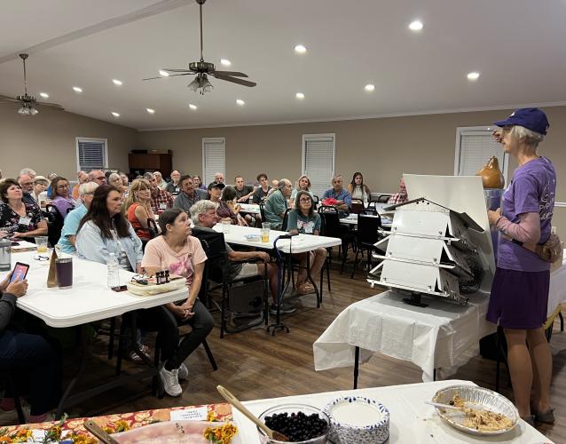 Kathy Stege leads a presentation about Purple Martin birds at PlowShare's 10 year anniversary meeting on Sept. 9, 2024. PlowShare brings in different guest speakers each month to address topics related to gardening. (Ella Kroll/Oglethorpe Echo)