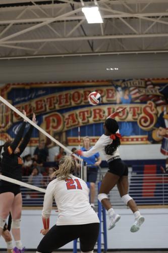 Kenzie Henderson skies over the net during the OCHS volleyball team’s victory over Clarke Central on Aug. 29. The Patriots are 7-4 heading into a quad match at North Oconee on Thursday, Sept. 5. (TY JOHNSTON/THE OGLETHORPE ECHO)