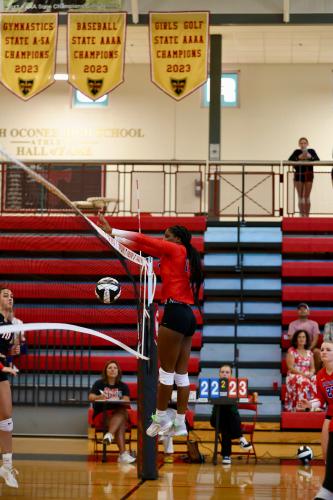 OCHS volleyball’s Kenzie Henderson soars above the net in a match last week at North Oconee. The Patriots are off to a 2-0 start in Area 8-A. (TY JOHNSTON/THE OGLETHORPE ECHO)