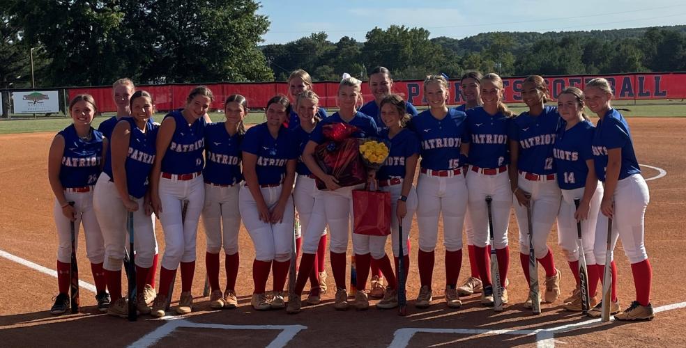 Carlee Gibson, the team’s lone senior, was honored before the game on Sept. 4. She was the starting pitcher and struck out two in two innings before finishing the game at third. (Submitted Photo)
