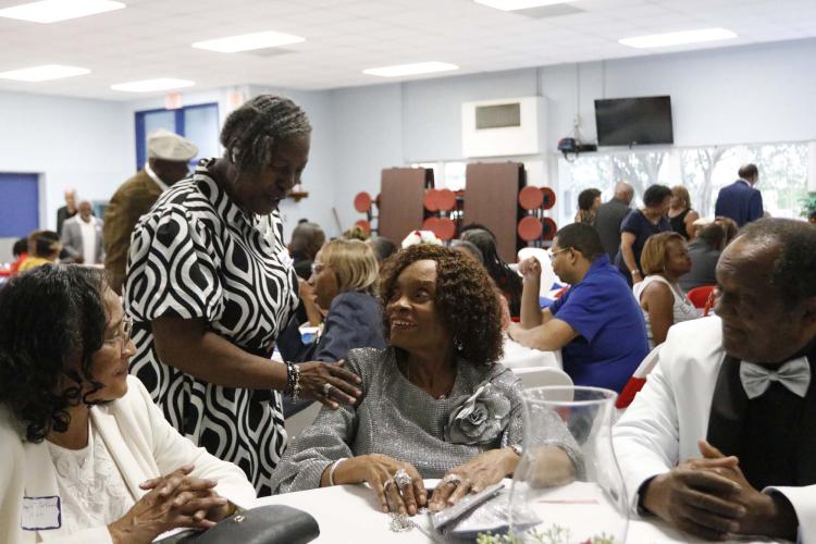Old friends reunite at Saturday’s commemorative program for the Oglethorpe County Consolidated School that opened in 1955 for Black students. The building, which is now Oglethorpe County Primary School, is scheduled to be torn down. (McCain Bracewell/The Oglethorpe Echo)