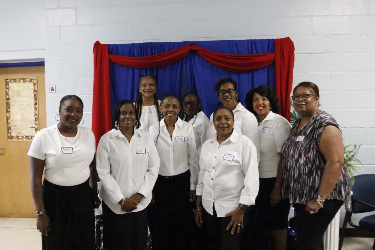 Volunteers pose at  the commemorative program for the Oglethorpe County Consolidated School, which is now Oglethorpe County Primary School, on Saturday, Sept. 28, 2024. The consolidated school opened in 1955 for African American students during segergation. OCPS is scheduled to be torn down in phase two of the new Oglethorpe County Elementary School construction. (McCain Bracewell/The Oglethorpe Echo)