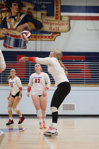 Nora Turner (17) and Sofia Horsley (27) watch OCHS teammate Elizabeth Cook make a shot on Oct. 16. Cook was selected as the Area 8 player of the year earlier this month. (TY JOHNSTON/THE OGLETHORPE ECHO)