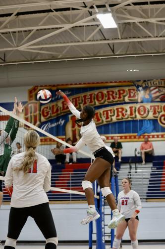 Kenzie Henderson soars over the net for a kill in Oglethorpe County’s victory over Athens Academy on Tuesday night. Henderson is one of three seniors on this year’s team. (Ty Johnston/The Oglethorpe Echo)