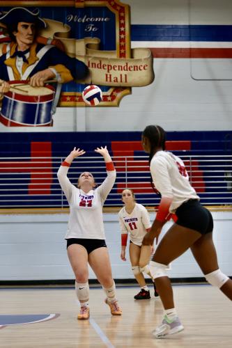 Senior Sofia Horsley prepares to set up Kenzie Henderson (right) and Nora Turner (17) during the win over Athens Academy on Tuesday night. Horsley, Henderson and teammate Samantha Amos were honored on senior night. (Ty Johnston/The Oglethorpe Echo)