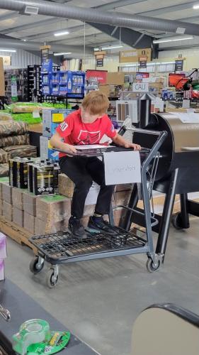 Trey Gabriel, a sixth-grader at OCMS, set up a makeshift desk to help people buying generators at Ace Hardware over the weekend. The store made sure to keep generators in stock for people affected by Hurricane Helene. (Submitted Photo)