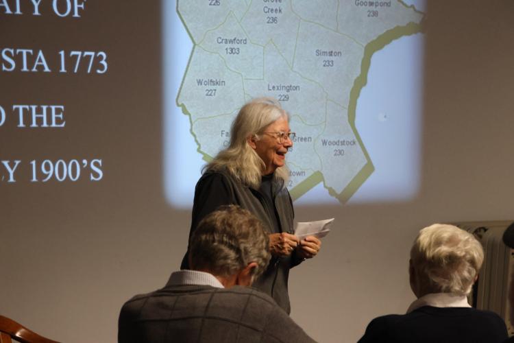 Kathleen deMarrais, president of Historic Oglethorpe County, introduces speaker Linda Bishop before her presentation on the history of Oglethorpe County at the library on Tuesday. It was the group’s final meeting of the year.