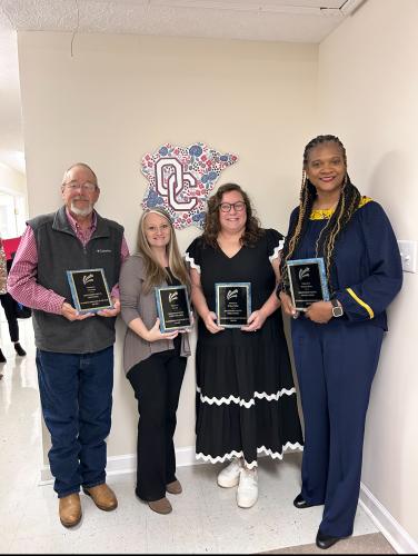 Carl Young (from left), who works at OCHS, Lori Hall (OCES), Madison Phillips (OCMS) and Everneda Moore (OCPS) were recognized as the Oglethorpe County Board of Education classified employees of the year at the BOE meeting on Tuesday. They were chosen by their peers for the recognition. (McCain Bracewell/The Oglethorpe Echo)