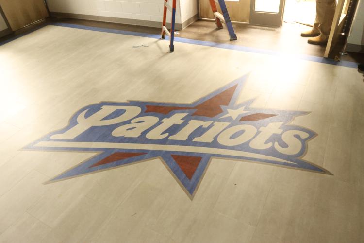 The word “Patriots” is displayed on the floor of the entrance to the Oglethorpe County Elementary School, which is scheduled to open in January. It will replace the current OCES and the primary school. (Avni Trivedi/The Oglethorpe Echo)