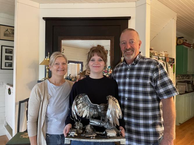 Maddy McKeel (center), with her mom Lori and dad Mike, display her turkey vulture sculpture that took silver at the SkillsUSA competition last February. McKeel is already working on a project for next year’s competition. (Dakota Meeks/The Oglethorpe Echo)