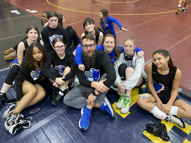 OCHS girls wrestling coach Josh Austin (center) and his team went 4-0 at the recent Yellow Jacket Scramble. Emily Gregory won her pool and went 4-0. Alyson Woods, Tessa Crosby, Cayla Hartrum and Tristin Caldwell each went 2-1. Team members include (from, from left): Nyah McAphee, Emily Gregory, Austin, Victoria Miller, Tristin Caldwell and Akira Owens; (back, from left): Alyson Woods, Cayla Hartrum and Tessa Crosby. (Submitted Photo)