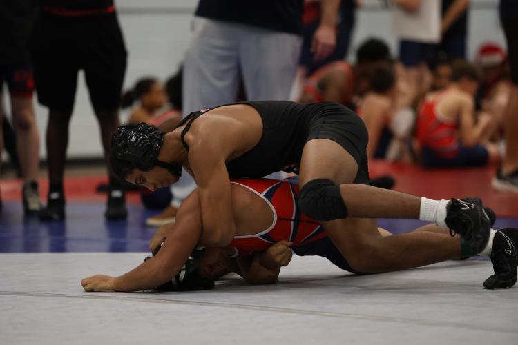 Oglethorpe County wrestler Keyvon Gresham gains the upper hand on his opponent in a match against Putnam County on Dec. 11. The Patriots defeated both Putnam County and Clarke Central. (Ty Johnston/The Oglethorpe Echo)