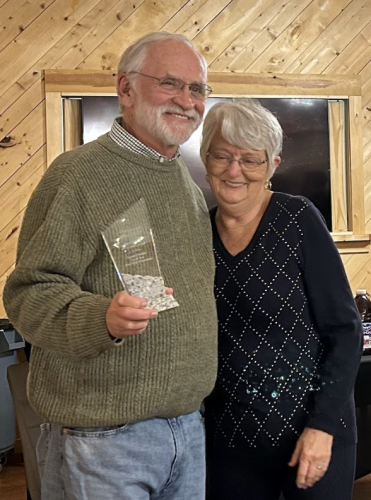 Linda Parish receives the Oglethorpe County Lifetime Achievement from Ronnie Boggs for her long service and work with the chamber of commerce. Parish is the chamber’s tourism and hospitality director. (Sarah Coyne/The Oglethorpe Echo)