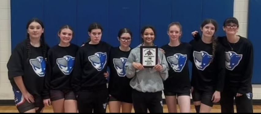 Members of the OCHS girls wrestling team show their plaque for finishing second at the Westside Christmas Classic on Dec. 21. Akira Owens won her class and two other Patriots finished second. (Submitted Photo)