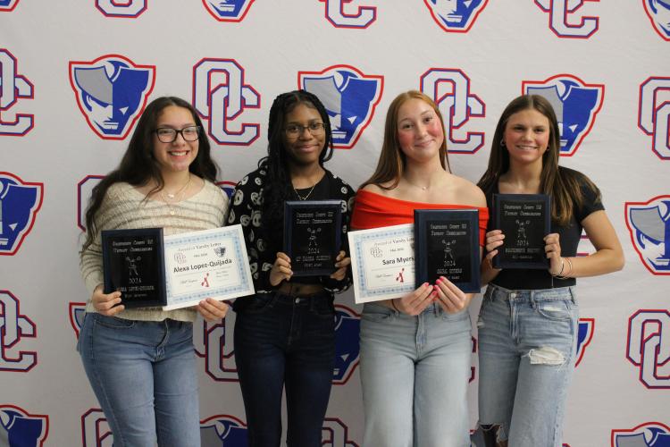 The cheer team award winners (from left): Alexa Lopez-Quijada (Most Improved), Qi’ Dasha Fleming (Spirit Award), Sara Myers (Patriot Award) and Mackensie Brown (All-American). (Audrey Pfitzner/The Oglethorpe Echo)
