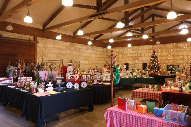 Vendors set up tables inside and outside of the Historic Depot during the Christmas Marketplace in Crawford last Weekend. The market place features goods, food, silent auctions and pictures with Santa and Mrs. Claus. (Photo/ Sarah Coyne)