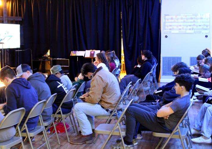 Students read their Bibles as Andy Paul, youth minister at Salem Baptist Church, delivers a lesson during youth group on Jan. 15. About 30-35 youth between the grades of six and 12 attend the weekly meetings. (Photo/Emily Slepsky)