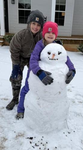Whit Wheless, who is 10 years old, and Lakin Wheless, 7, spent part of the day building a snowman, which was about 4 feet tall, at their home in the Lexington/Sandy Cross area, Courtney Wheless wrote. “It was definitely the most snow they have ever had to play in,” she wrote. (Submitted Photo)