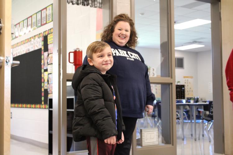 Grady Deaton, 6, and first-grade teacher Katie Cook are all smiles during the first open house at Oglethorpe County Elementary School on Tuesday. The new school is scheduled to open on Friday. (Sarah Coyne/The Oglethorpe Echo)