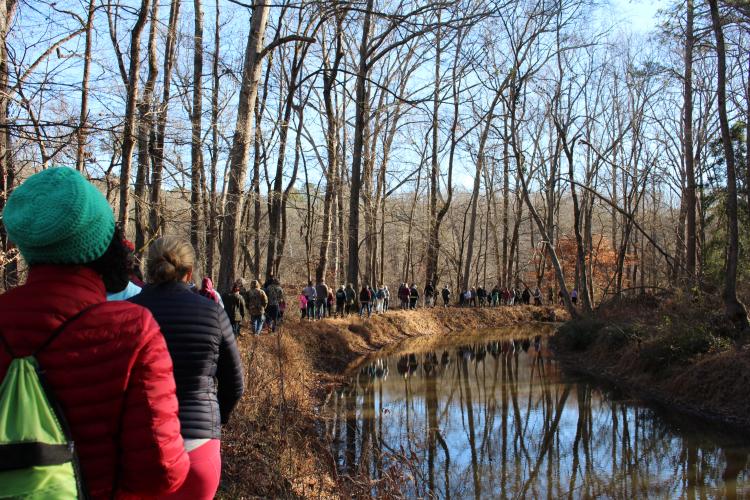 Folks snap photos of each other at Watson Mill Bridge State Park on New Year’s Day. About 92 people showed up for the park’s annual First Day Hike, three times more than last year. (Dakota Meeks/The Oglethorpe Echo)