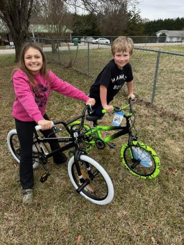 Harper Bondie (left) and Colton Hansford (right) with their new bikes that were purchased with the help of Leisha Shipp and Steve Fields. These bikes replaced Christmas presents that went missing on Dec. 26. (Submitted Photo)