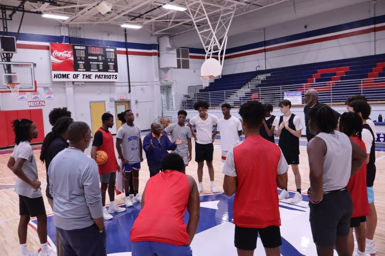 The Oglethorpe County High School varsity boys basketball team is 1-12 overall and 1-5 in their region. Head Coach Carlos Strong says this year is a "building year" as he is focusing on the culture of the team. The team is huddled after practice on Wednesday, Jan. 15 to debrief their practice. (Photo/ Avery Cameron)