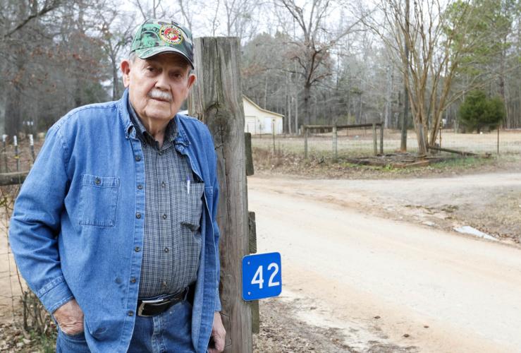 Randy Gordon, a resident of Oglethorpe County’s Almond Drive, poses in front of his house at 42 Almond Drive on Wednesday, Feb. 5, 2025. Gordon purchased his house from the road’s namesake Mr. Almond, and has lived on Almond Drive for over 25 years. (Photo/Felix Scheyer)