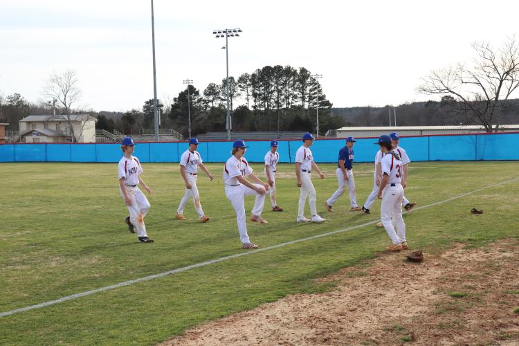 Oglethorpe County baseball players warm up during a recent practice. The Patriots will look to their pitching to lead them through Region 8-A Division I play this season. (AVERY CAMERON/THE OGLETHORPE ECHO)