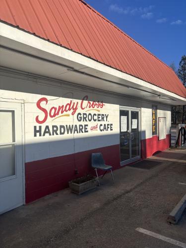 (Jet Rawls/ The Oglethorpe Echo) The entrance sign for Sandy Cross Grocery, Hardware, and Cafe.